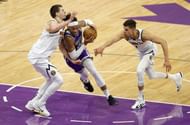 Nikola Jokic #15 and Michael Porter Jr. #1 of the Denver Nuggets on defense.